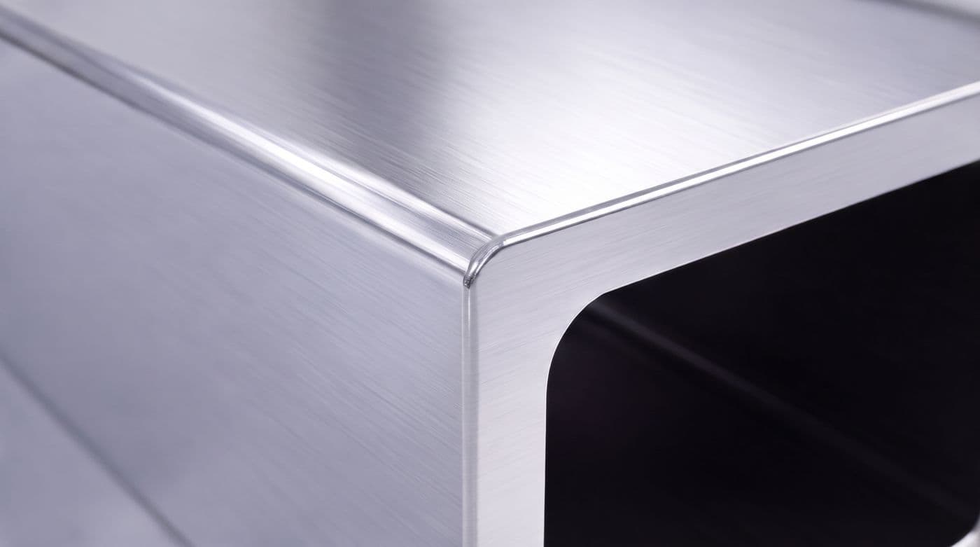 Macro view of a roll-formed steel corner — folded, not welded